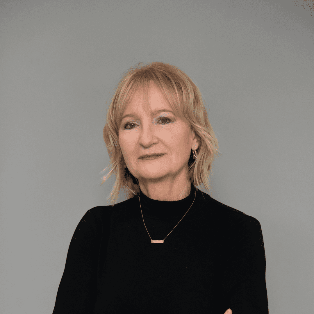 Portrait of Wanda K., a professional stylist at The Changing Room Salon, showcasing their expertise and style.