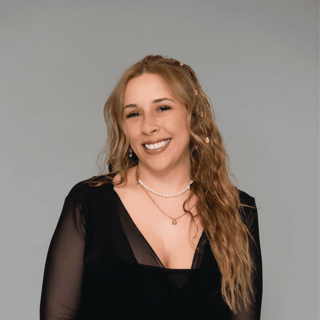 Portrait of Steph D., a professional stylist at The Changing Room Salon, showcasing their expertise and style.