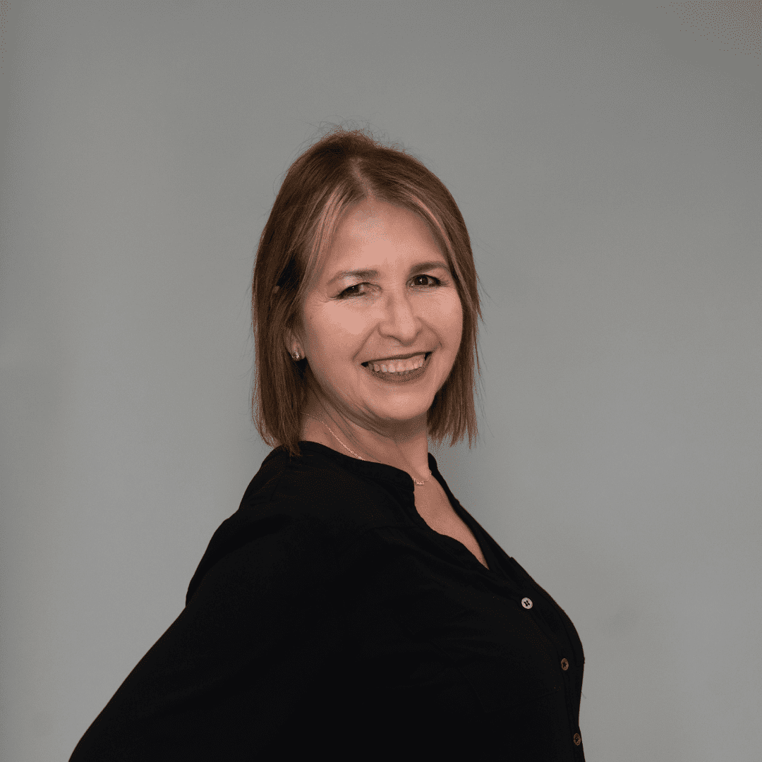 Portrait of Lilly H., a professional stylist at The Changing Room Salon, showcasing their expertise and style.