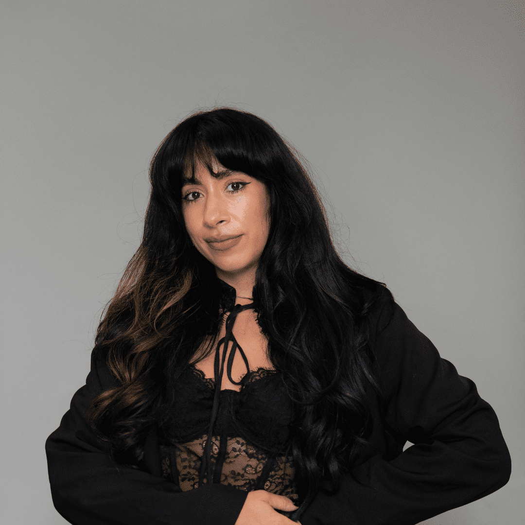 Portrait of Silvia A., a professional stylist at The Changing Room Salon, showcasing their expertise and style.