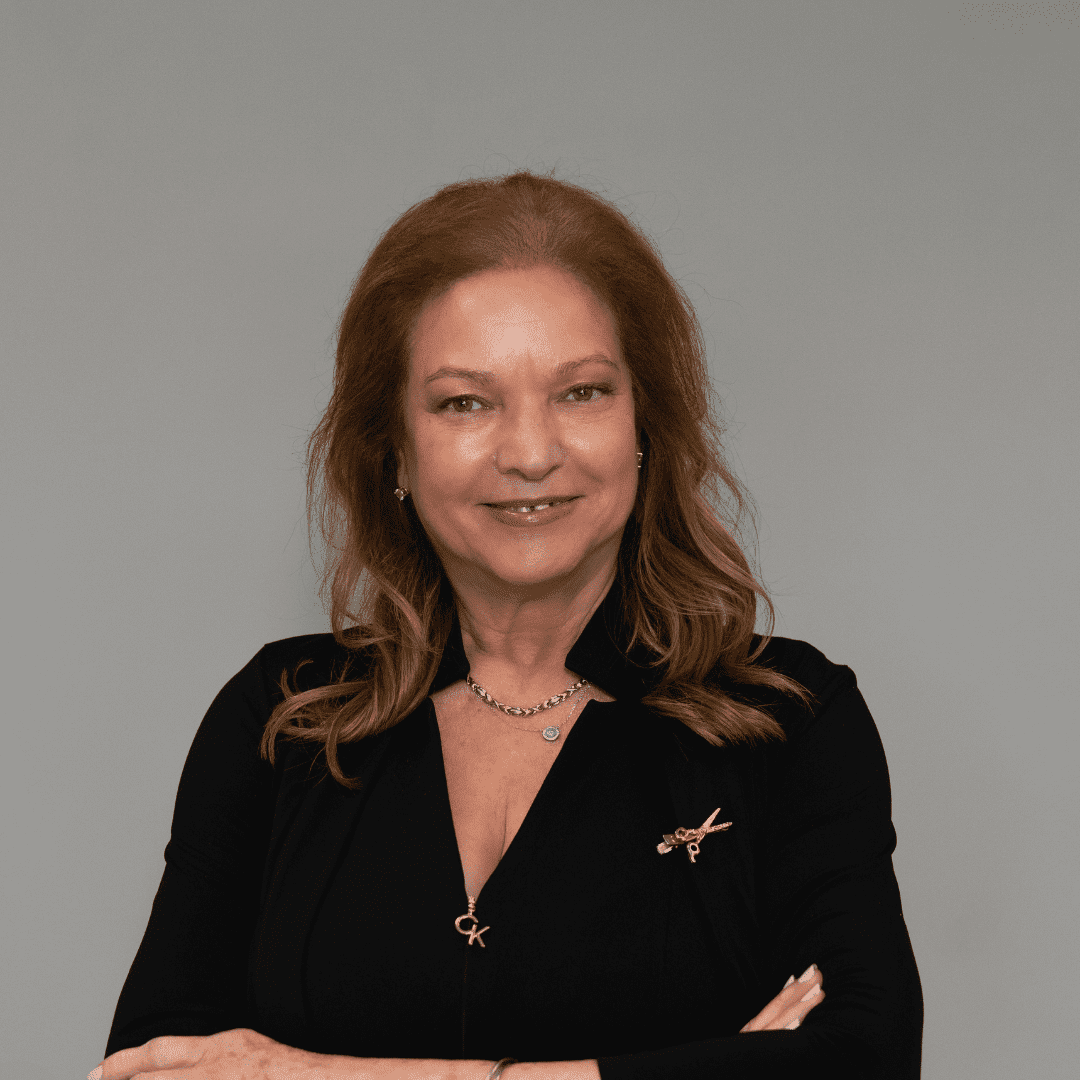 Portrait of Brigida C., a professional stylist at The Changing Room Salon, showcasing their expertise and style.