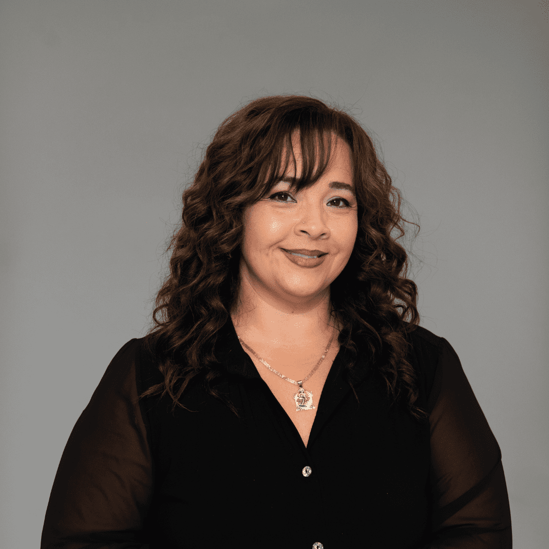 Portrait of Emmy S., a professional stylist at The Changing Room Salon, showcasing their expertise and style.